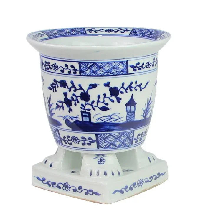 Jardinière sur pied bleu foncé et blanche avec motif de scène de village